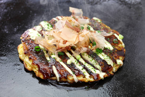 Okonomiyaki is a Japanese savory pancake containing a variety of ingredients