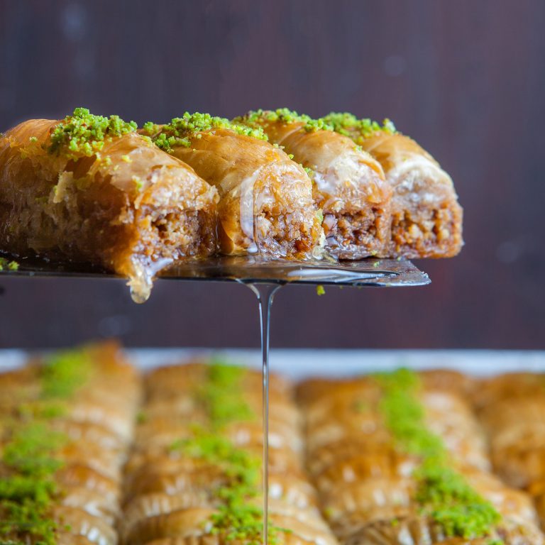 Close-up turkish baklava dessert made of thin pastry, nuts and honey